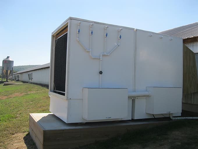 An acid air scrubber connected to a livestock barn to manage ammonia and odour emissions. Picture source: https://www.frontiersin.org/articles/10.3389/fsufs.2018.00023/full 